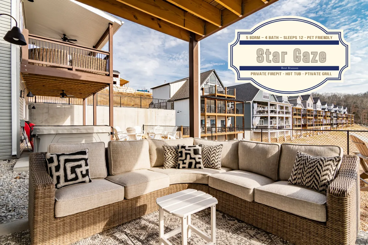 This scene encompasses a comfortable outdoor seating area with a fire pit, surrounded by scenic views. A private grill is also visible, establishing the space as a gathering spot for both relaxation and lakeside cookouts, where guests can create memories by the fire or grill together.